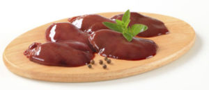 Raw chicken liver on cutting board